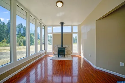 Ranch house sunroom with wood stove